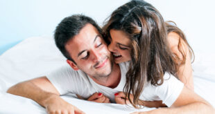 young couple with playful behavior in bedroom.