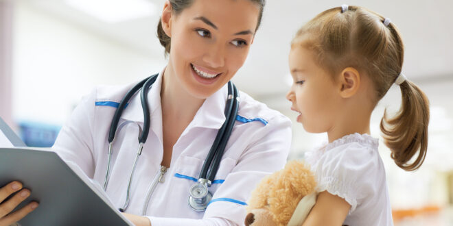 doctor examining a child in a hospital
